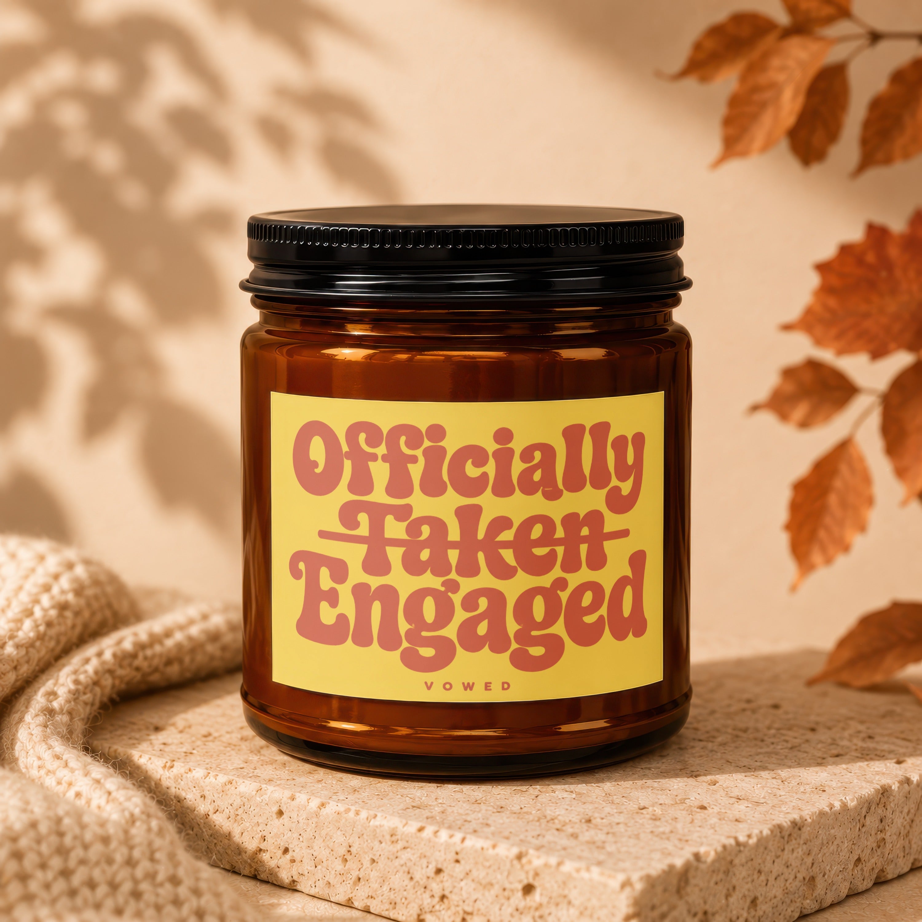 Brown glass candle with yellow label reading "Officially Taken Engaged Vowed".
