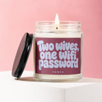 Candle with text "Two wives, one wifi password" on a pink background.