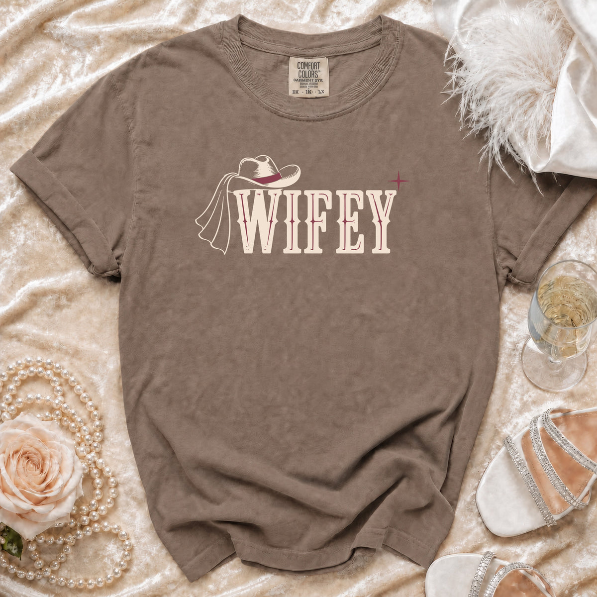 Brown Comfort Colors t-shirt with "WIFEY" text and a cowboy hat graphic.