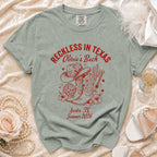 "Reckless in Texas" shirt with cowboy boots, hat, and disco ball, for Olivia's Bach.