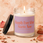 Candle with "Happily Ever After Starts Now" text in orange on a pink label.