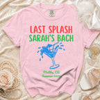 Pink t-shirt with "Last Splash Sarah's Bach" and cocktail graphic.