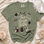 Green t-shirt with "This Bride Bites" text and gothic wedding graphics.