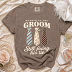 Brown t-shirt with "Mother of the Groom Still Fixing His Tie" and three ties.