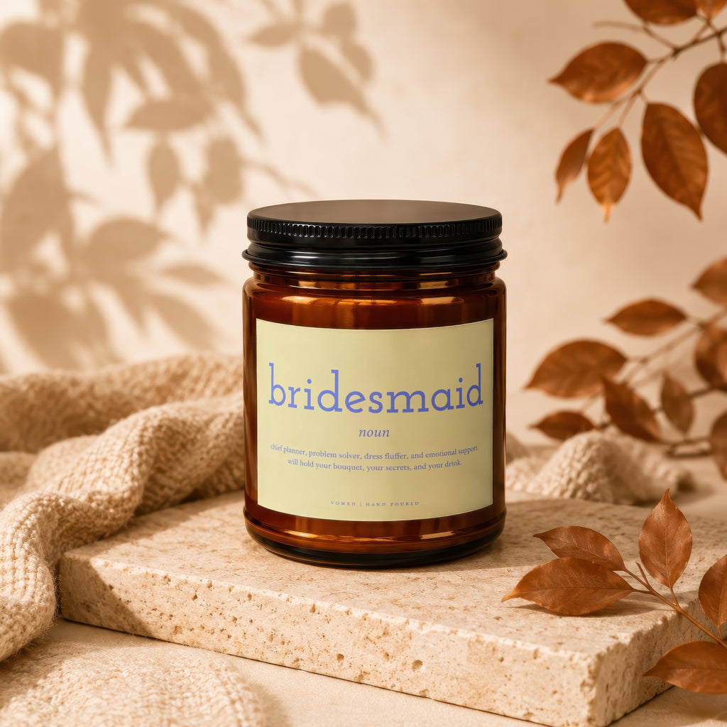Amber jar candle labeled "bridesmaid" with humorous definition.