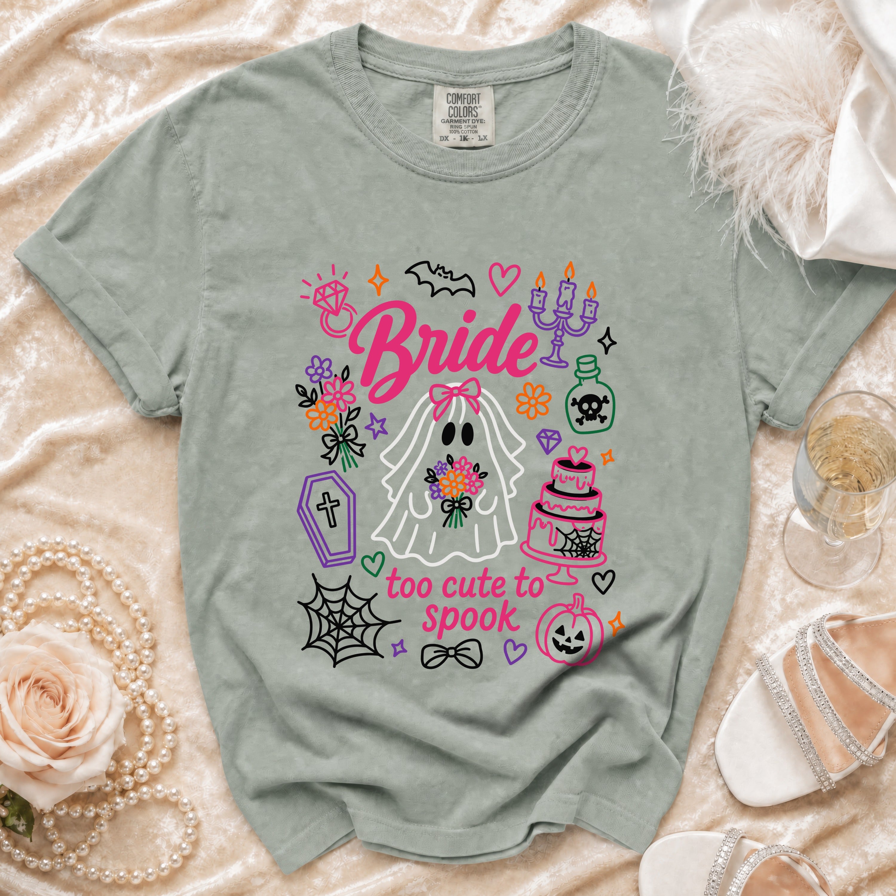 Ghost bride shirt with "too cute to spook" text and Halloween icons.