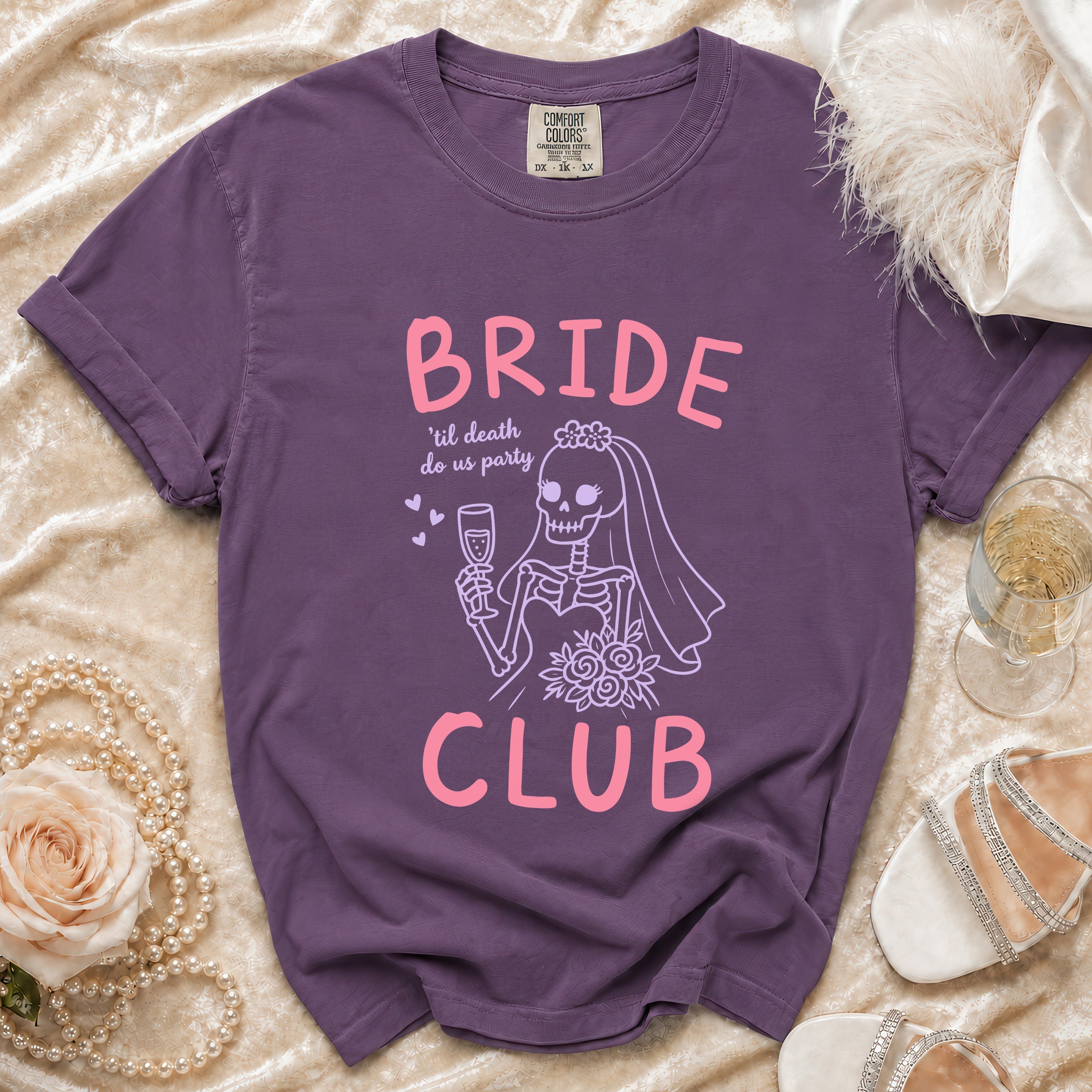 Purple t-shirt with Bride 'til death do us party skeleton graphic and CLUB text.