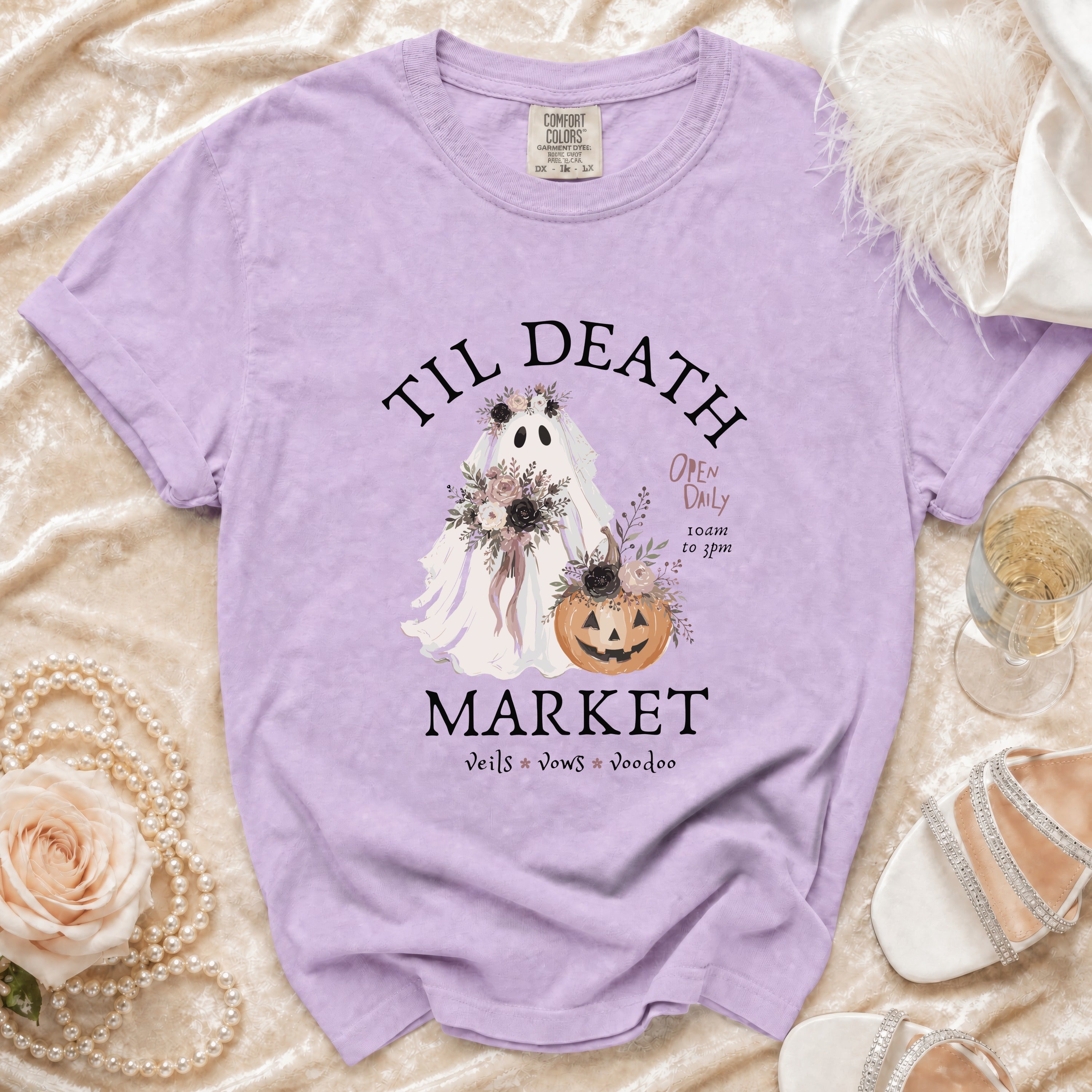 Purple t-shirt with "Til Death Market" text, ghost bride, and pumpkin graphic.