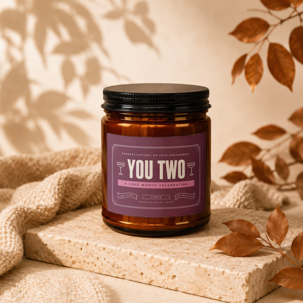 Amber candle with "YOU TWO A LOVE WORTH CELEBRATING" label.