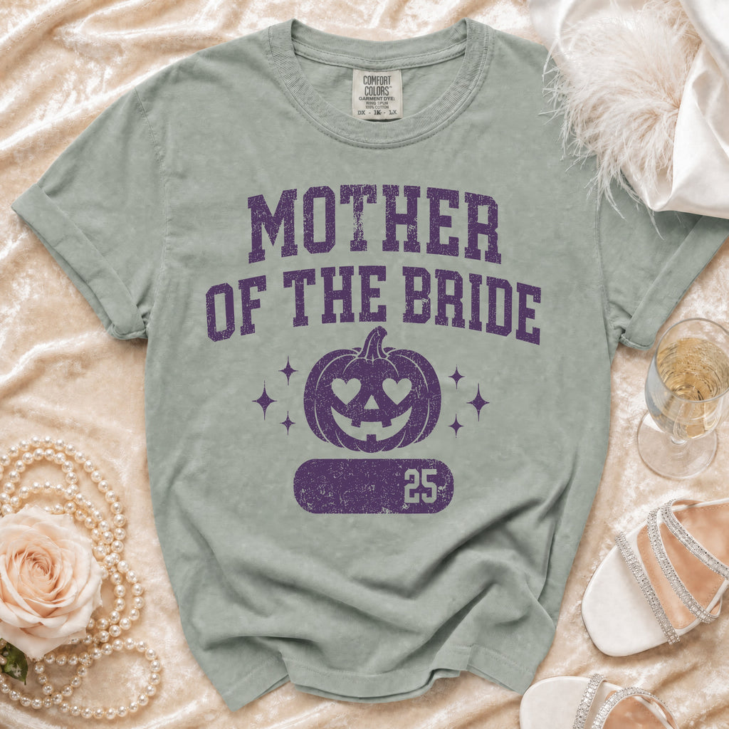 Green t-shirt with "Mother of the Bride" text and pumpkin graphic.