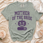 Green t-shirt with "Mother of the Bride" text and pumpkin graphic.