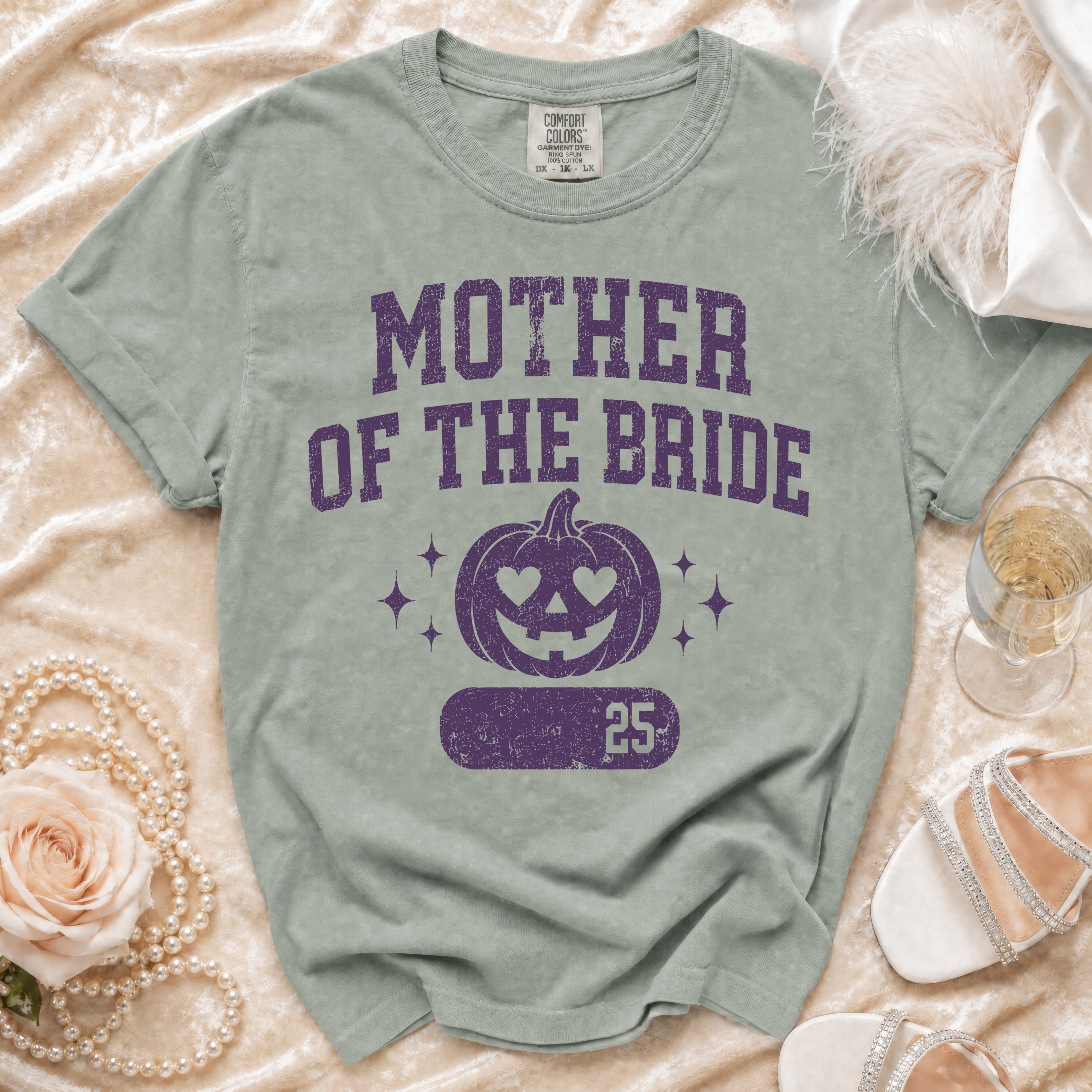 Green t-shirt with "Mother of the Bride" text and pumpkin graphic.