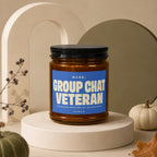 Candle with blue label reading "Rank: Group Chat Veteran, Fourteen Months of Active Duty, Vowed".