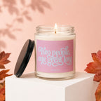 Lit candle with pink label reading "Two people, one great love", VOWED