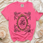 Pink t-shirt with "Her Last Rodeo" and bachelorette details in a western oval design.