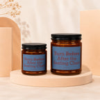 Two amber glass candles with black lids, showing "Burn Before After the Seating Chart" text.
