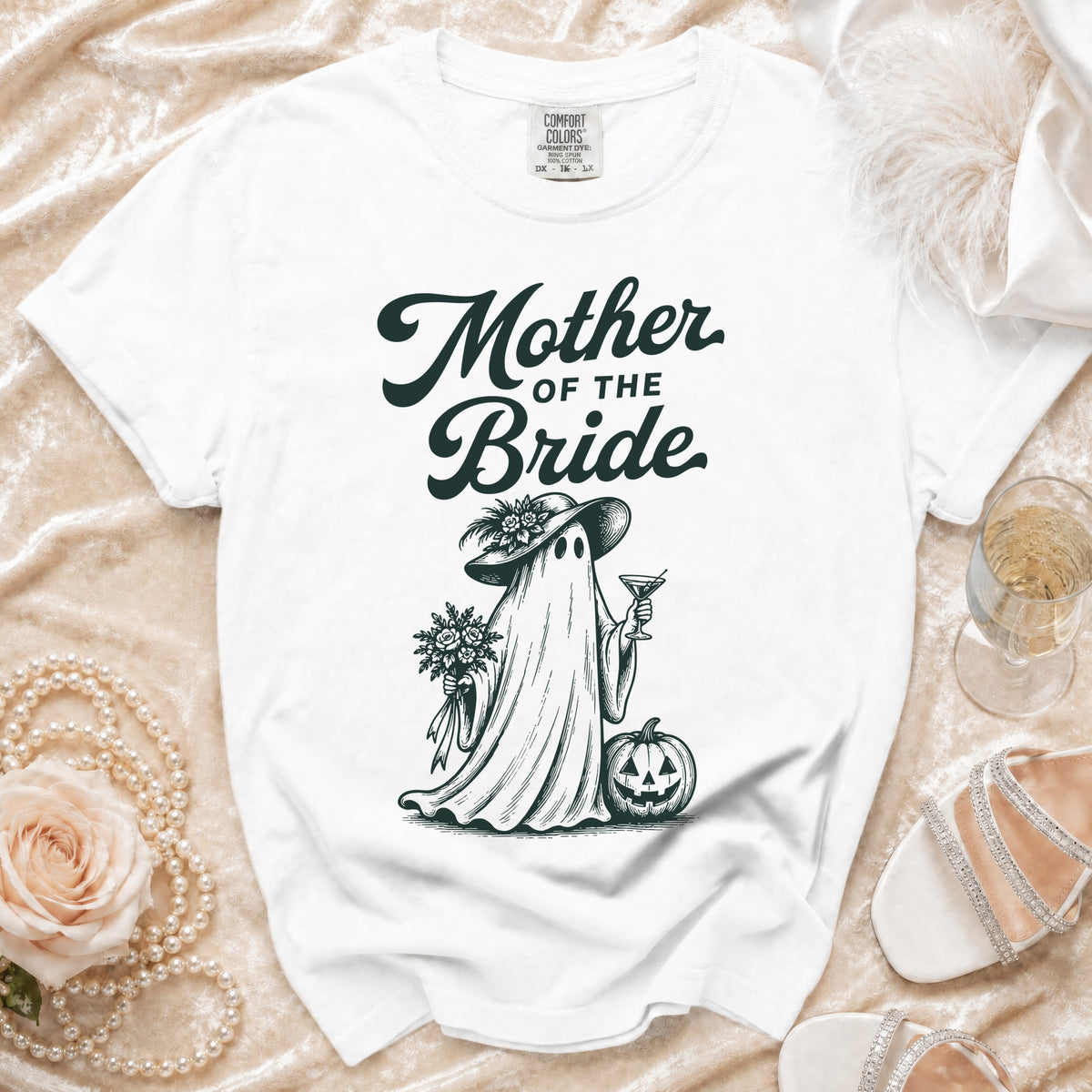 White t-shirt with "Mother of the Bride" text and a ghost illustration.
