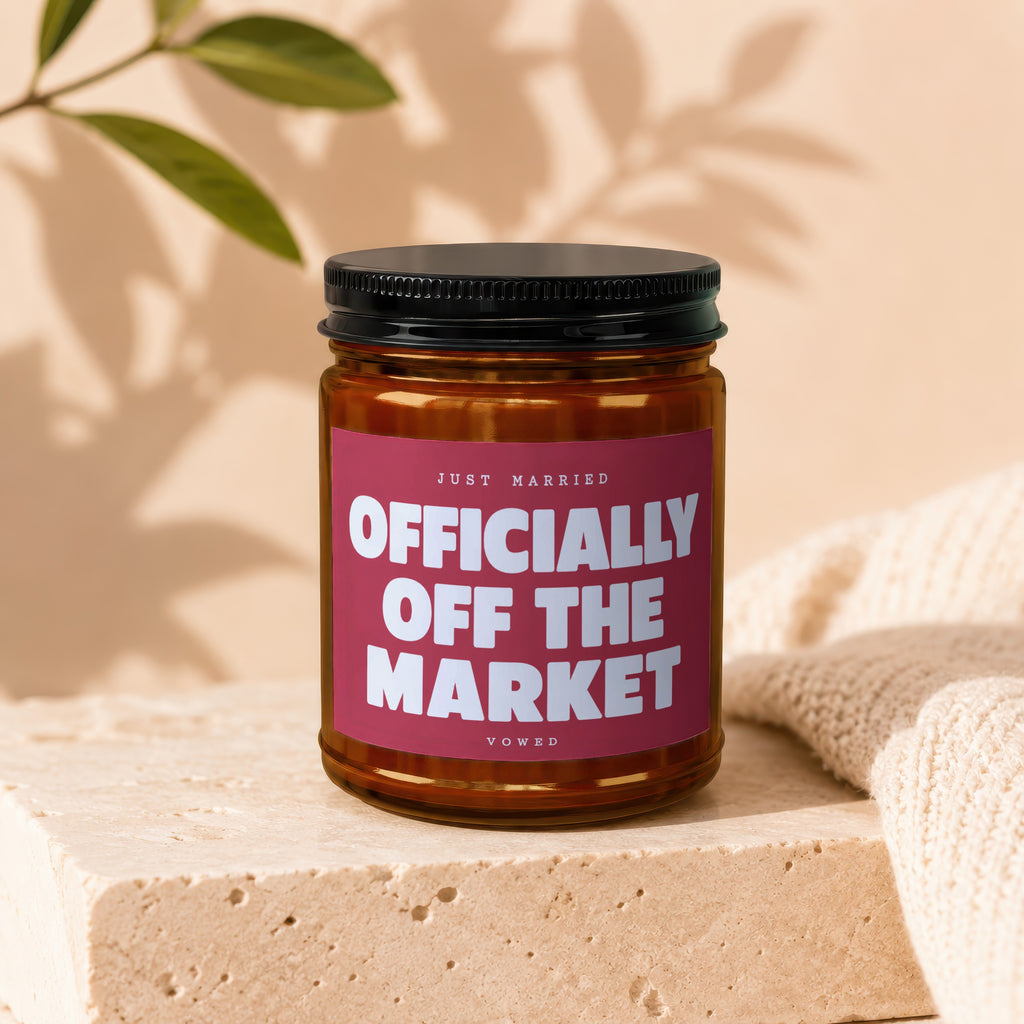Candle with "Just Married Officially Off The Market Vowed" text on a burgundy label.
