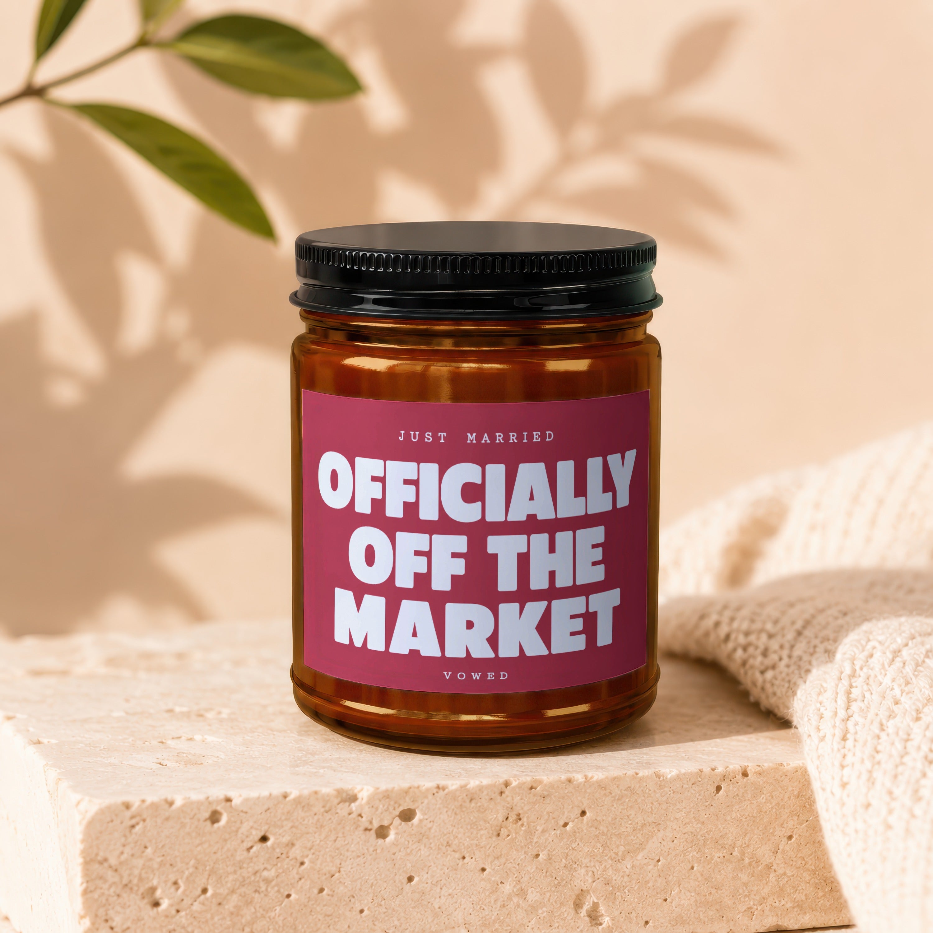Candle with "Just Married Officially Off The Market Vowed" text on a burgundy label.