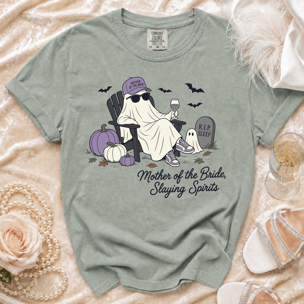 Ghost wearing "Mother of the Bride" hat, sunglasses, chair, wine, and text "Mother of the Bride, Slaying Spirits."