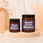 Two brown glass jars with purple labels reading "Guest Coven Member".
