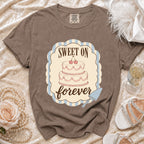 T-shirt with a cake graphic and the text "SWEET ON forever".