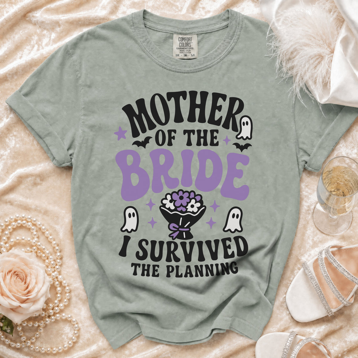 Gray t-shirt with "MOTHER OF THE BRIDE I SURVIVED THE PLANNING" text and ghost graphics.