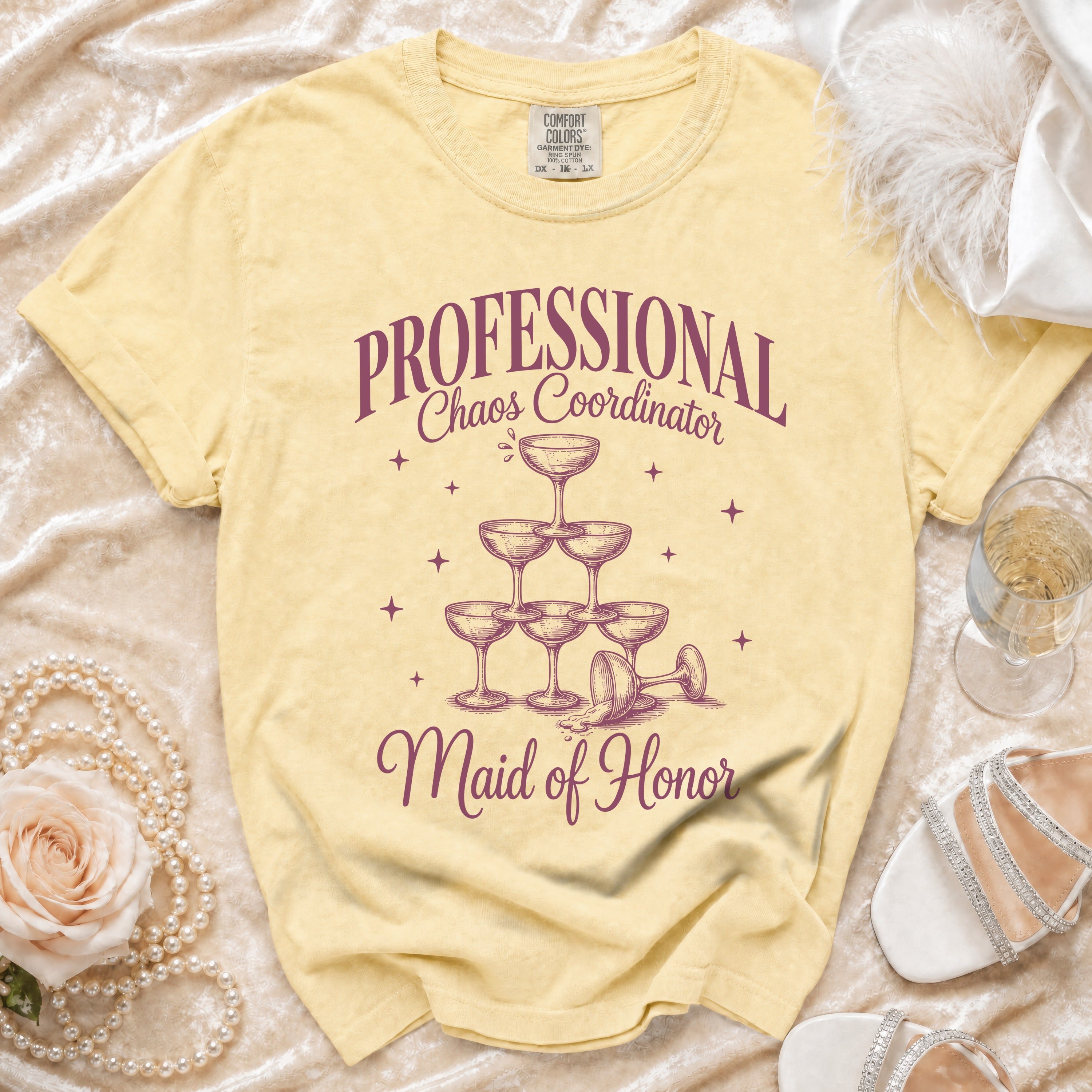 Yellow t-shirt with "PROFESSIONAL Chaos Coordinator Maid of Honor" and champagne glasses.