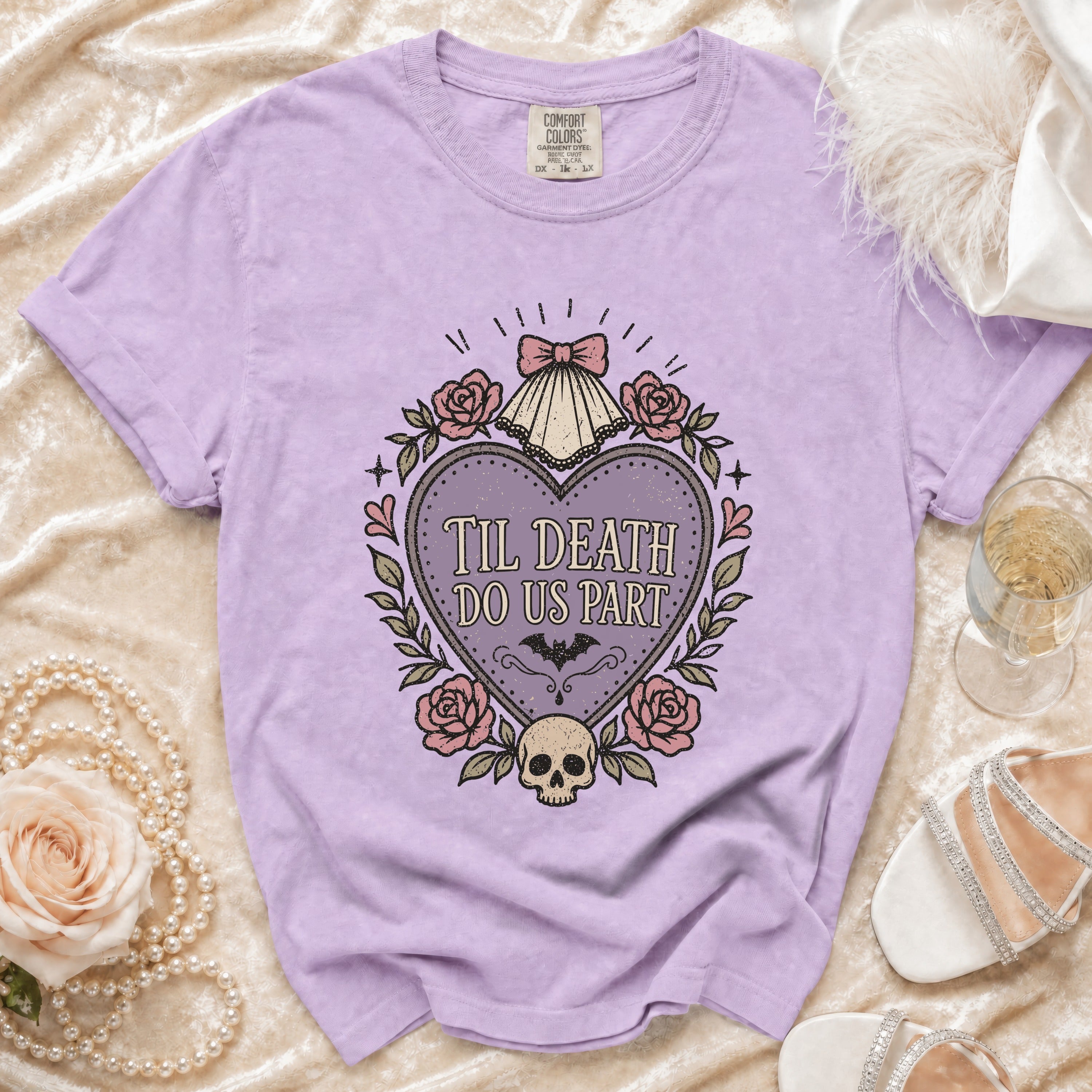 Lilac t-shirt with "Til Death Do Us Part" heart graphic, roses, skull, and bat.