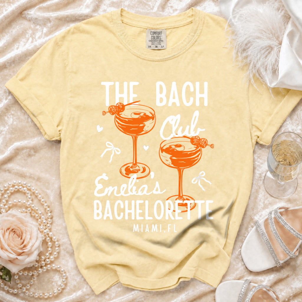 Yellow t-shirt with "The Bach Club" and "Enelia's Bachelorette Miami, FL".