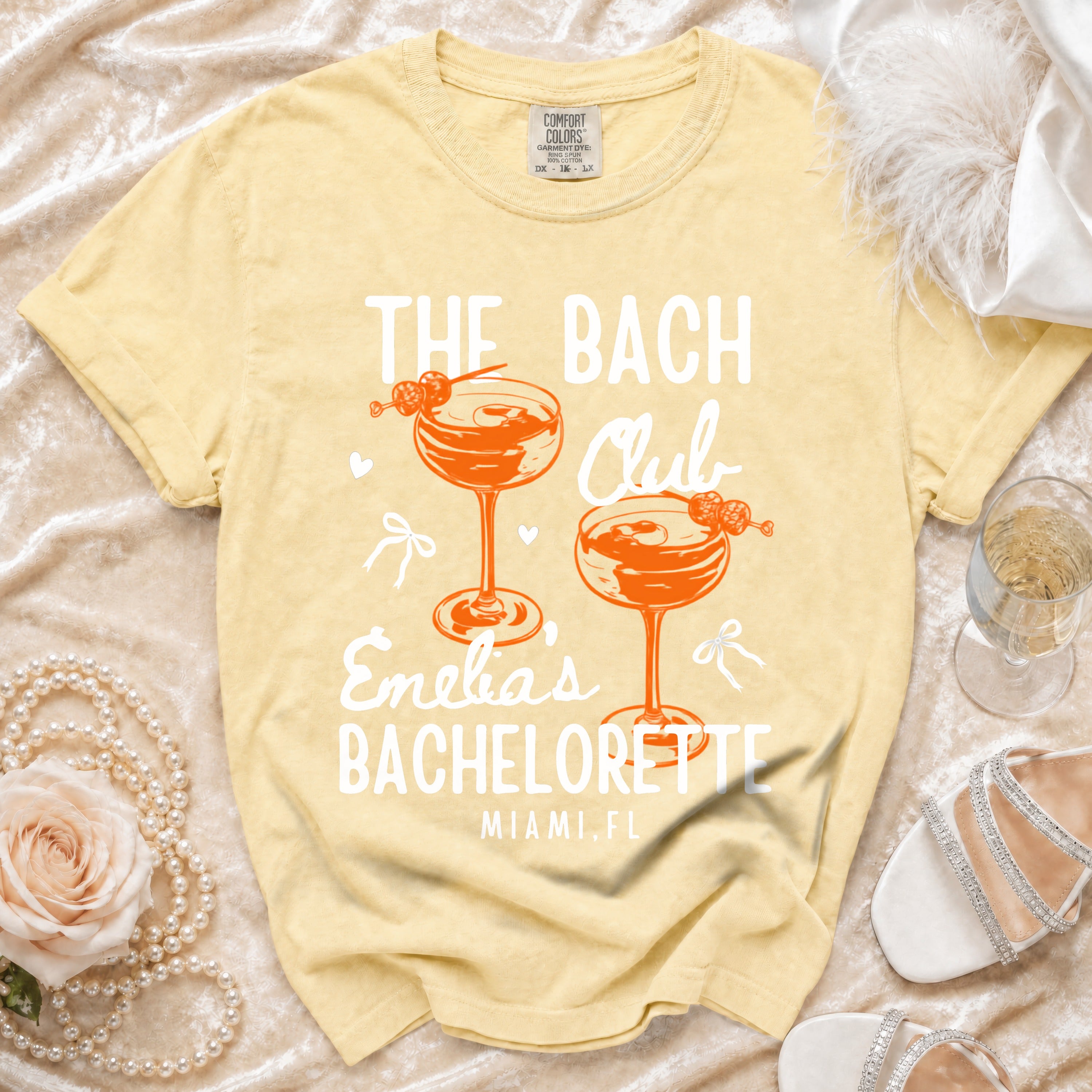 Yellow t-shirt with "The Bach Club" and "Enelia's Bachelorette Miami, FL".