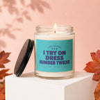 Candle with label "Light me when I try on dress number twelve"