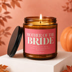Candle with text "Mother of the Bride" on a pink label.