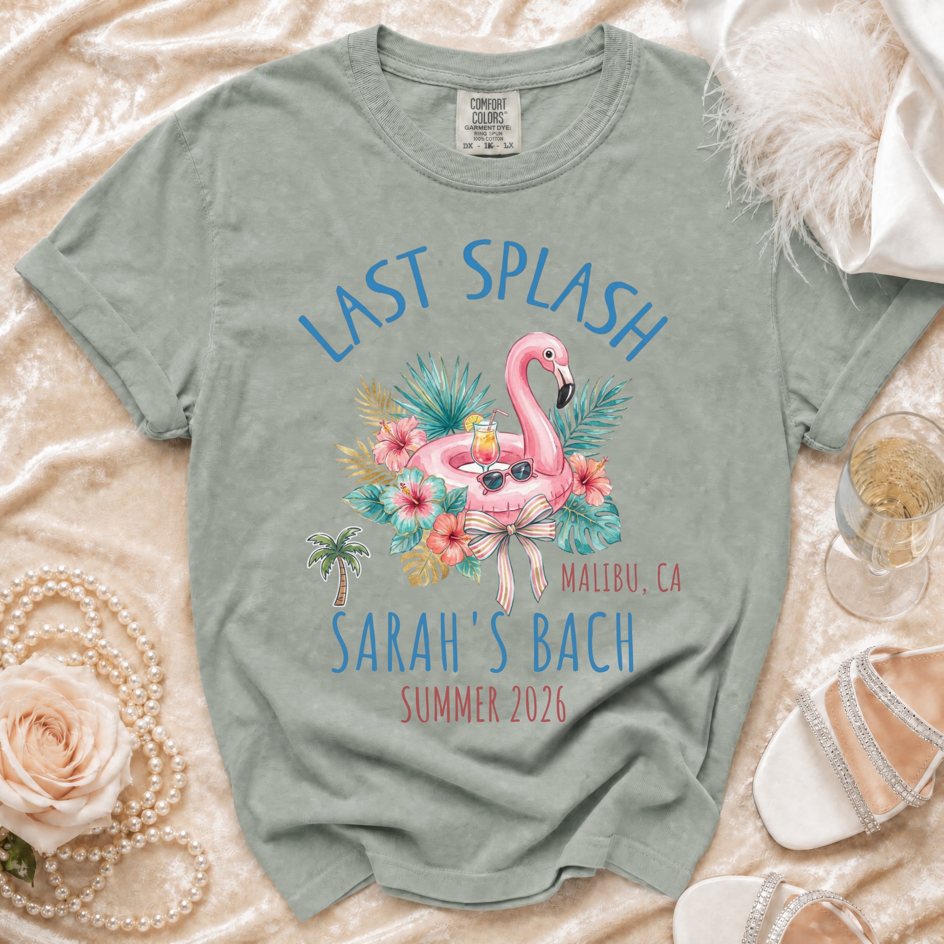 Last Splash t-shirt with flamingo, hibiscus, and text "Malibu, CA Sarah's Bach Summer 2026".