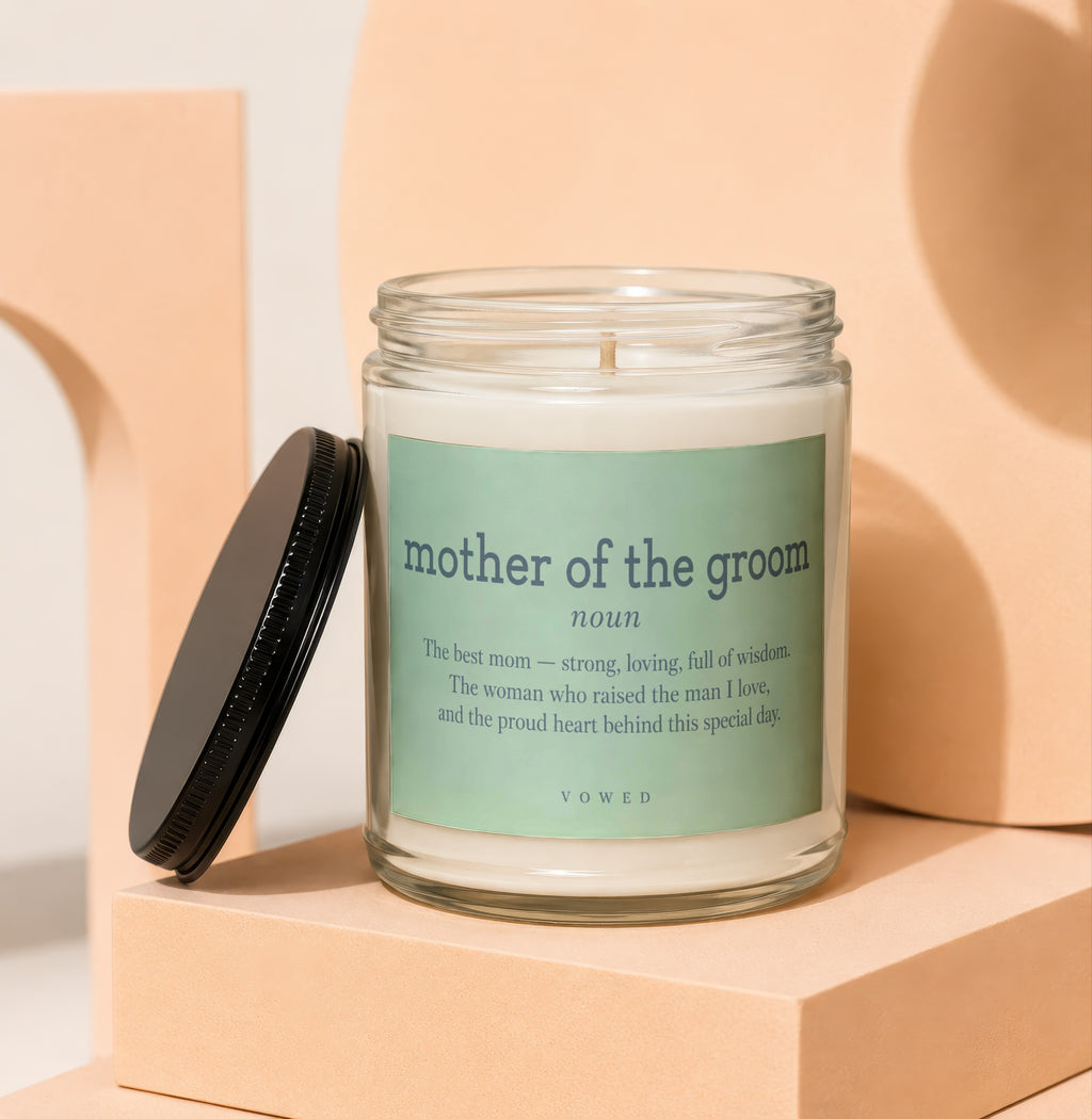Glass candle with "mother of the groom" defining text label.