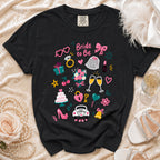 Black t-shirt with "Bride to Be" and wedding icons print.