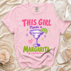 Pink t-shirt with "THIS GIRL Needs a Margarita" text and a margarita graphic.
