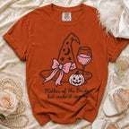 Orange t-shirt with witch hat, pumpkin, wine glass, and "Mother of the Bride... but make it spooky" text.
