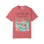 Coral t-shirt with "Last Splash Sarah's Bach" graphic of people on inflatable flamingos.