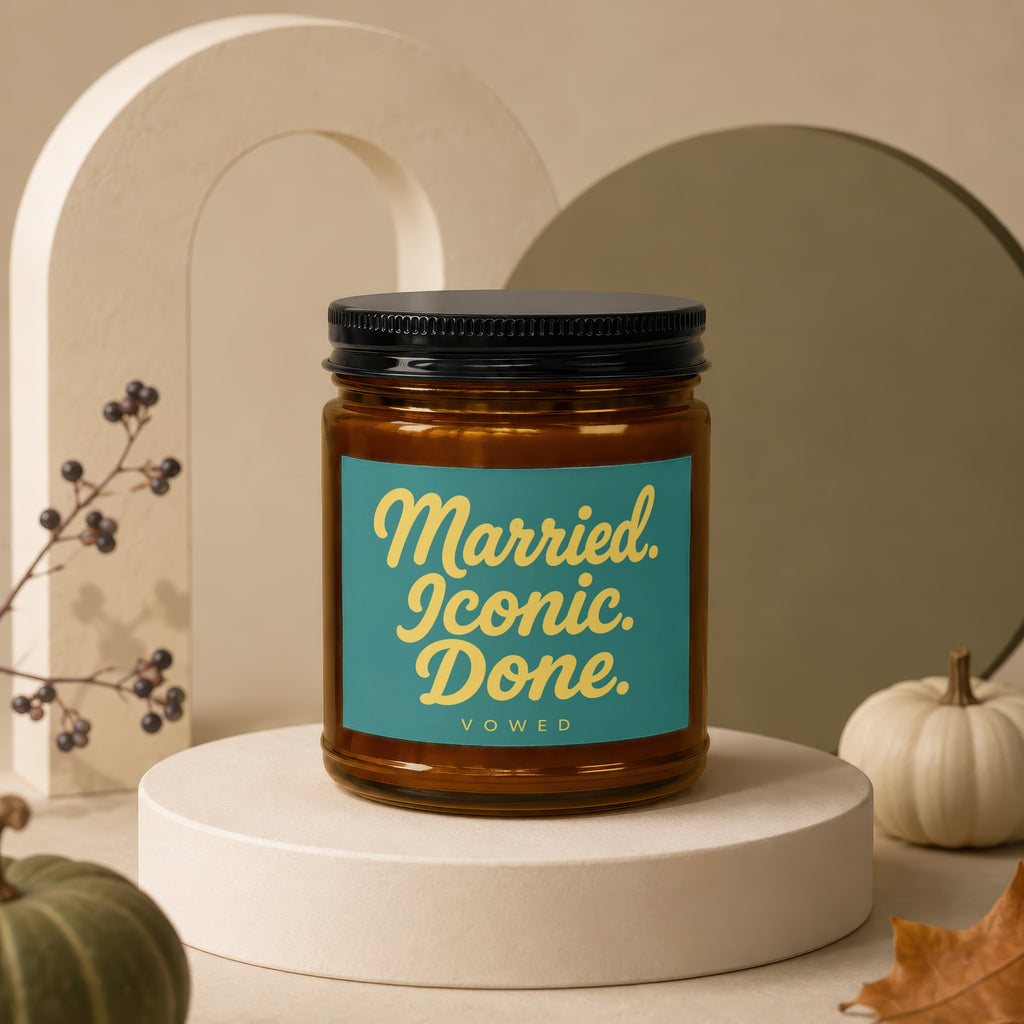 Amber candle with teal label reading "Married. Iconic. Done. VOWED."