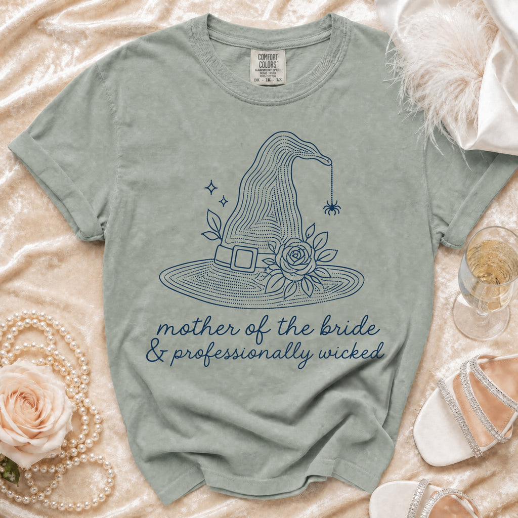 T-shirt with witch hat, spider, roses, and text "mother of the bride & professionally wicked."