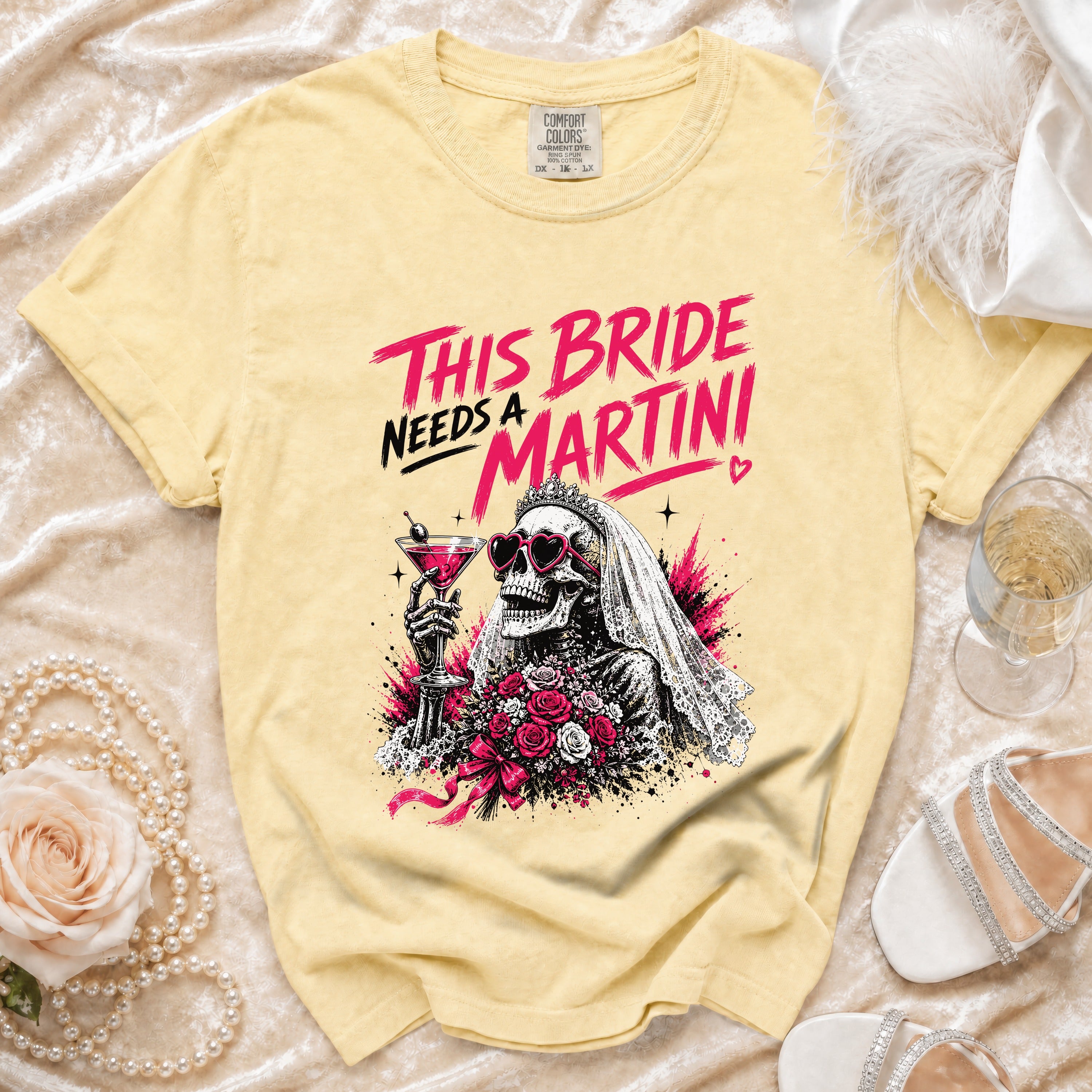 Yellow T-shirt with skeleton bride graphic saying "This Bride Needs a Martini".