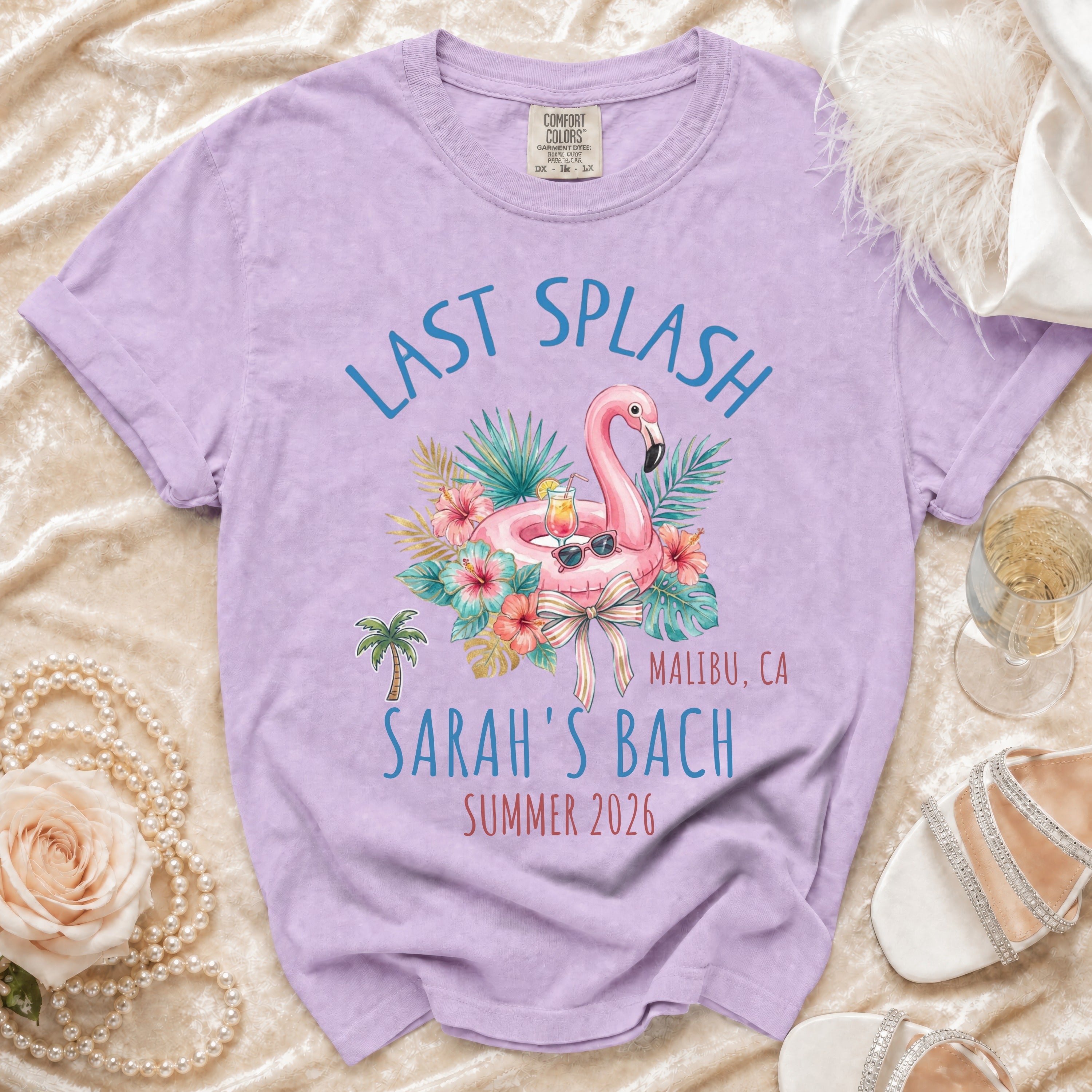 Lilac t-shirt with "Last Splash" and "Sarah's Bach" in tropical design.