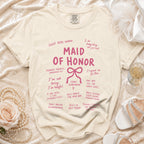 Cream t-shirt with "Maid of Honor" and wedding party roles printed in pink.