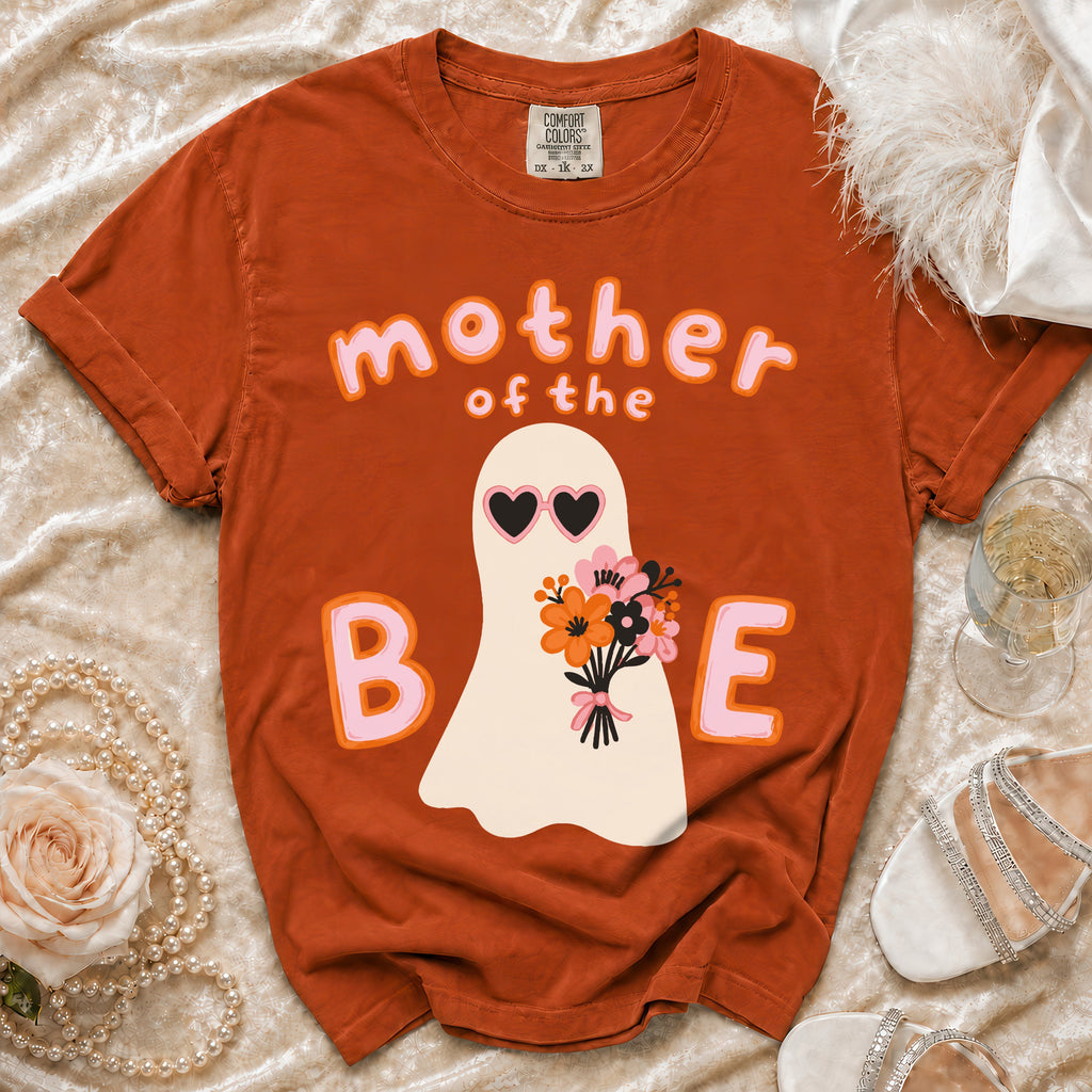 Orange t-shirt with "mother of the B E" and a ghost holding flowers graphic.