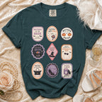 Teal t-shirt featuring nine oval graphics with spooky and bridal themes.