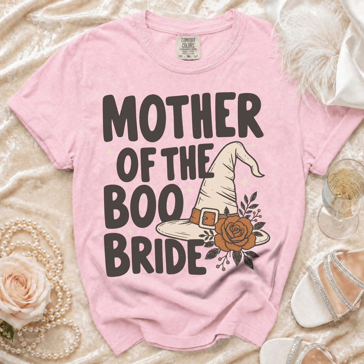 Pink t-shirt with "Mother of the Boo Bride" text and witch hat graphic.