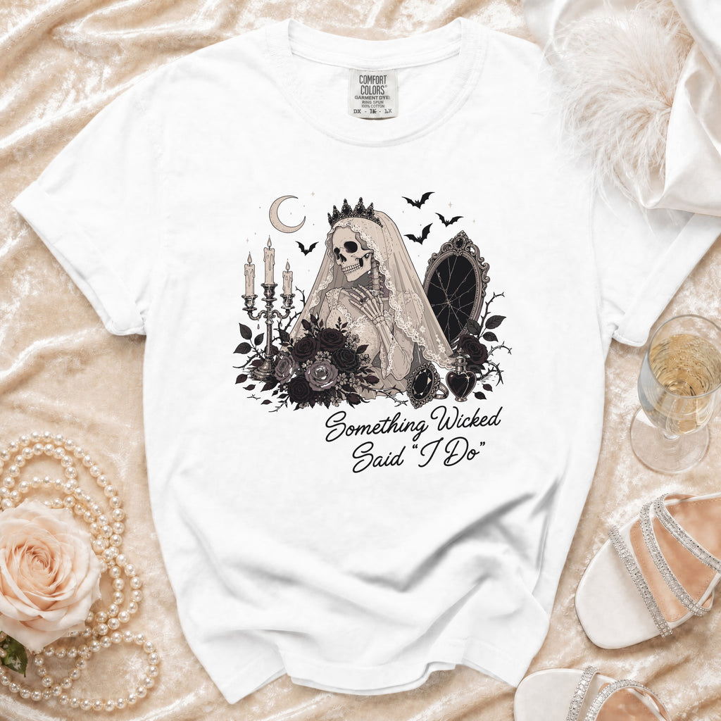 White t-shirt with a skeleton bride graphic and "Something Wicked Said 'I Do'".