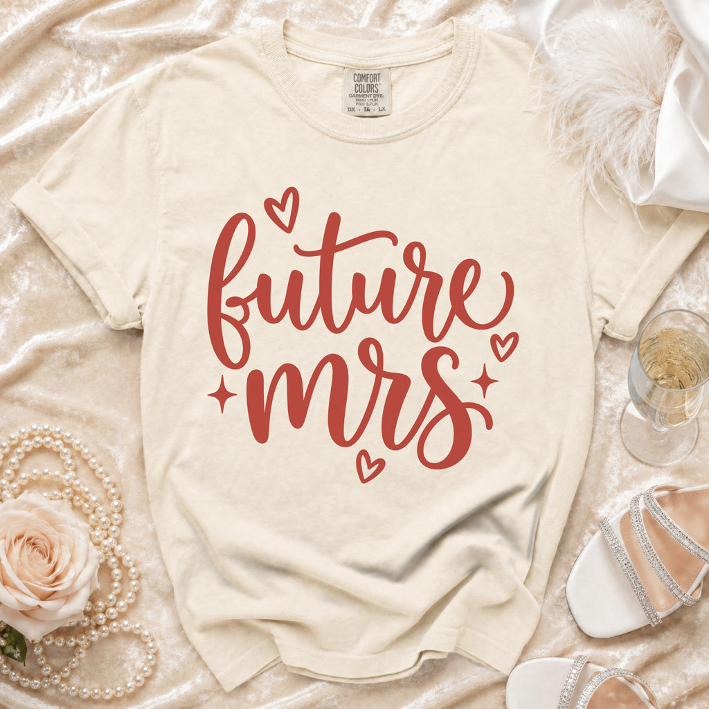 Future Mrs t-shirt with red script text and hearts, on a cream background.