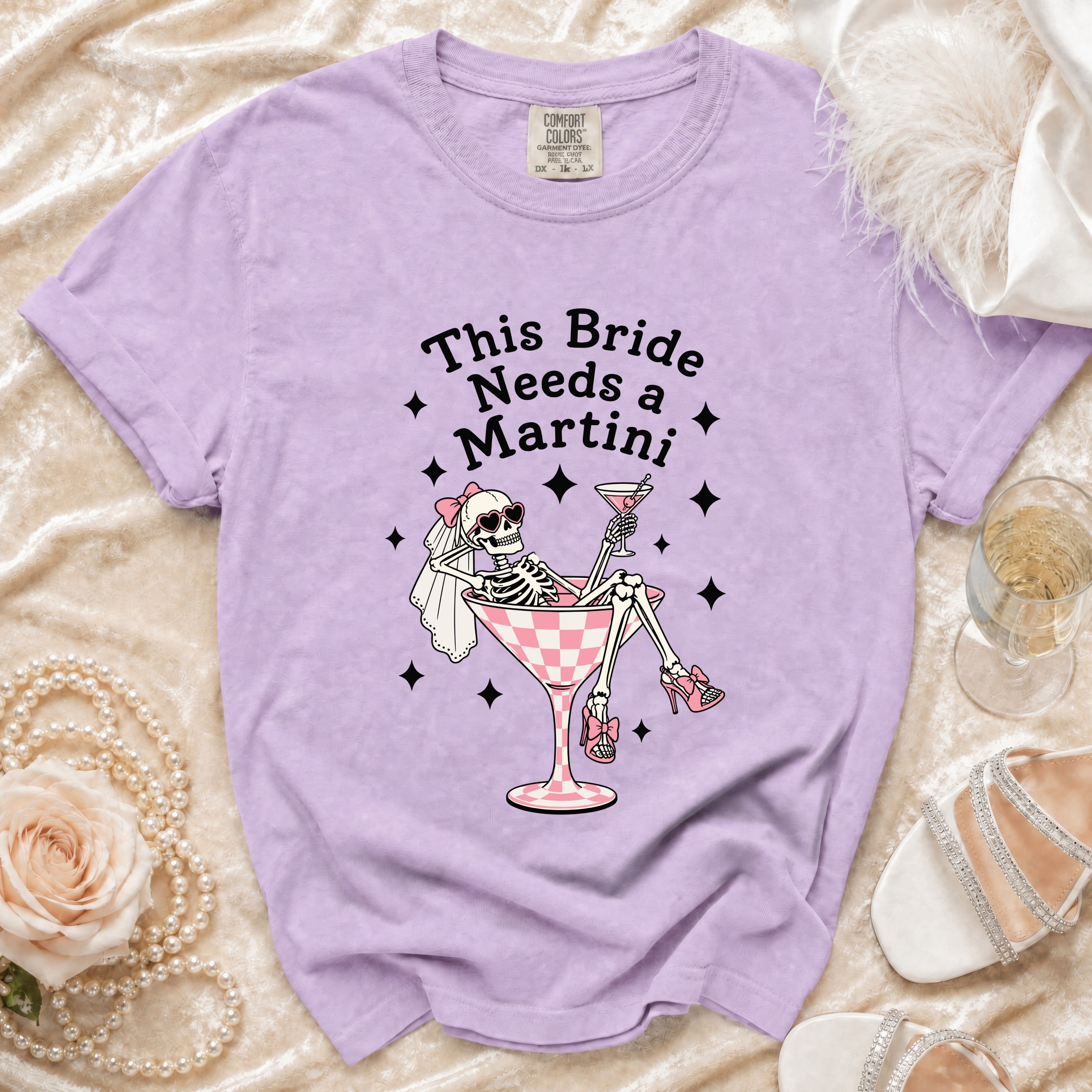 T-shirt with skeleton bride graphic and text "This Bride Needs a Martini".